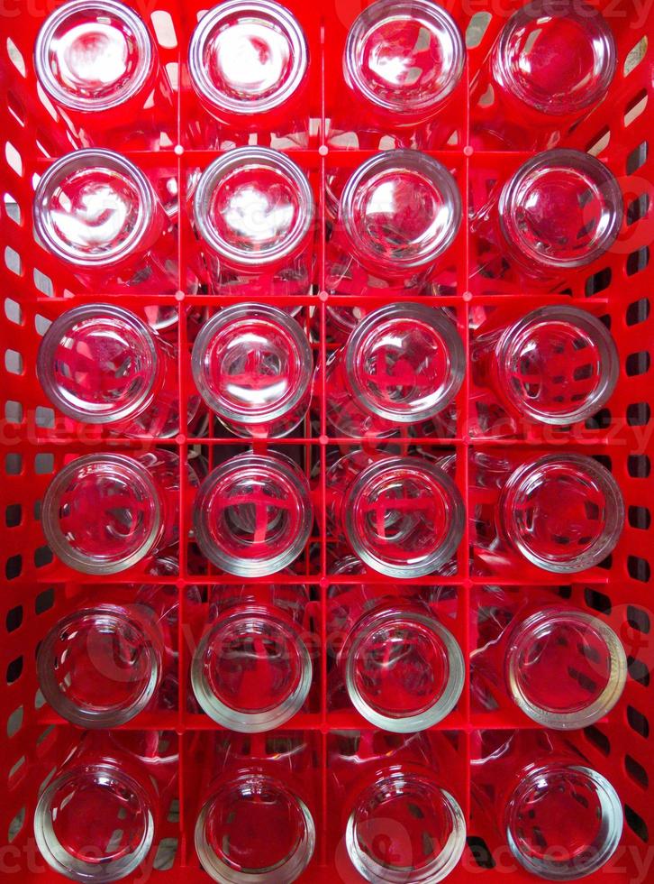 a-lot-of-clean-drinking-glasses-are-collected-in-the-red-plastic-crate-photo