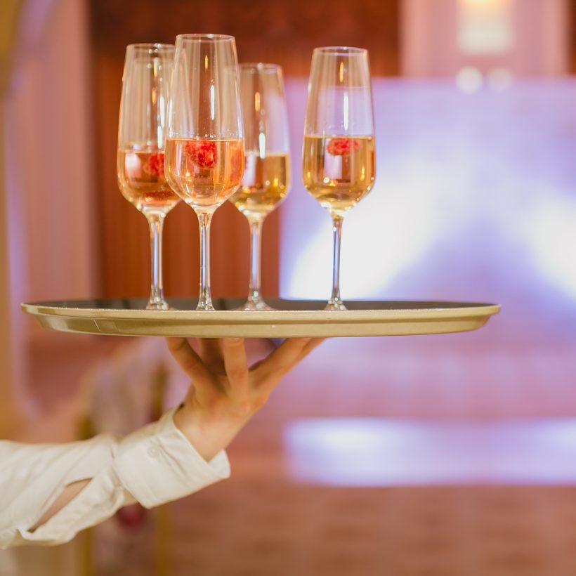 waiter-serving-champagne-tray