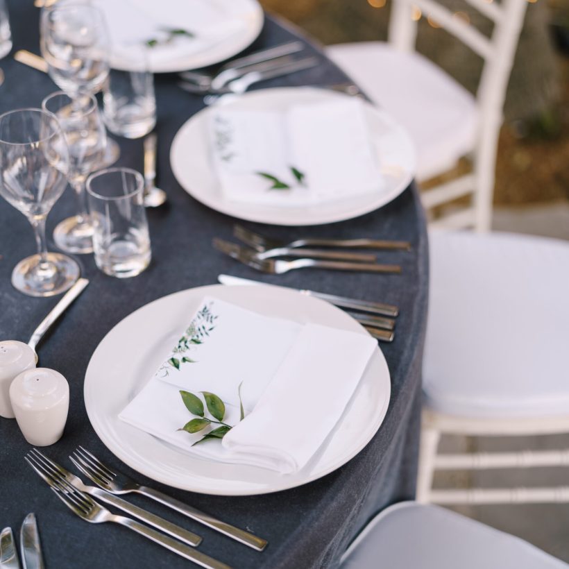 wedding-dinner-table-reception-white-round-plates-round-table-with-gray-tablecloth-white
